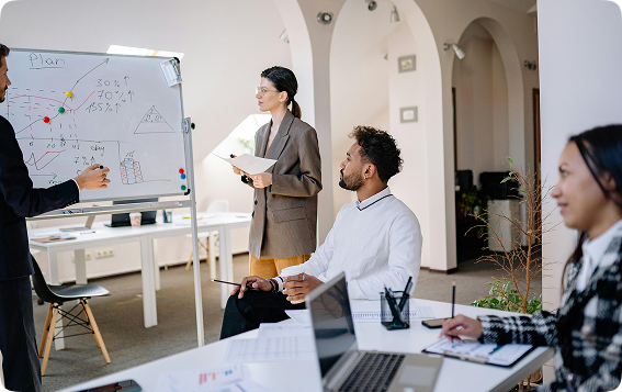 Engineers working with holographic AI technology in a futuristic lab environment